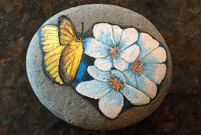 Butterfly and Flower Rock Painting